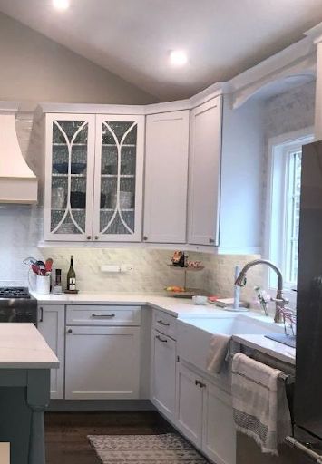 A beautiful white kitchen with a farmhouse sink